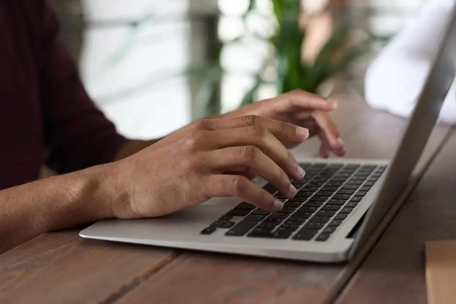 An image of a person typing on a laptop with a blog icon in the background.